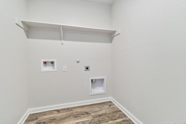 washroom featuring hookup for a gas dryer, hardwood / wood-style floors, washer hookup, and hookup for an electric dryer