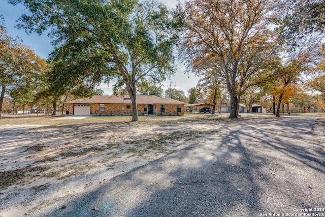 single story home featuring a garage