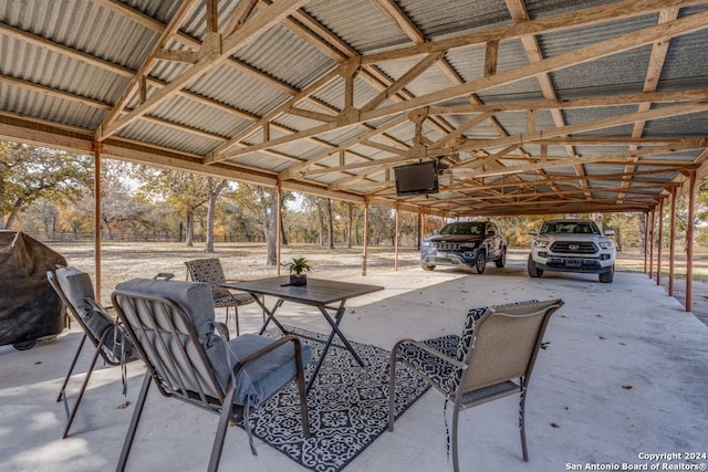 view of patio / terrace with area for grilling and a carport