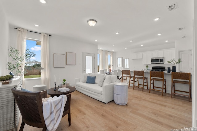 living room featuring light wood-type flooring