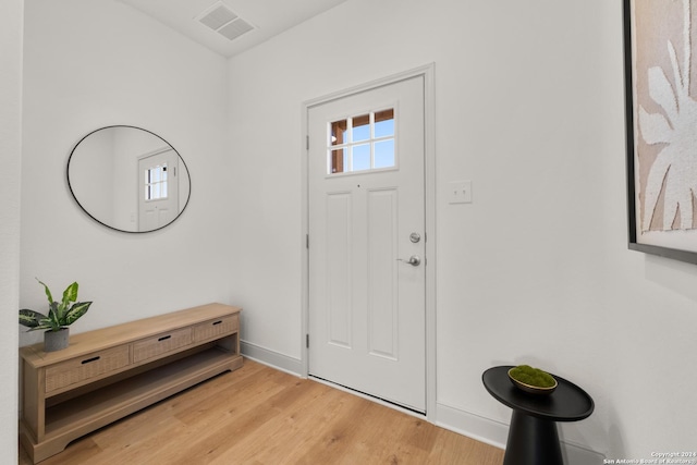 entryway with hardwood / wood-style floors