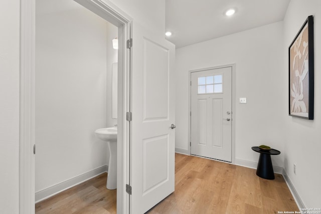 entrance foyer featuring light hardwood / wood-style floors and sink