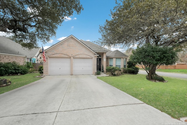 view of front of property with a garage and a front lawn