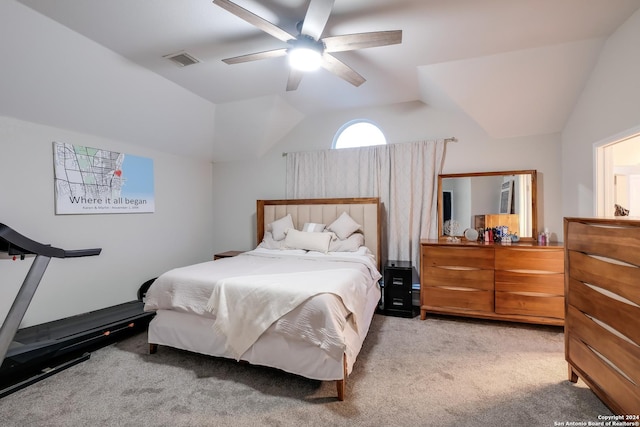 bedroom featuring ceiling fan, light carpet, and vaulted ceiling