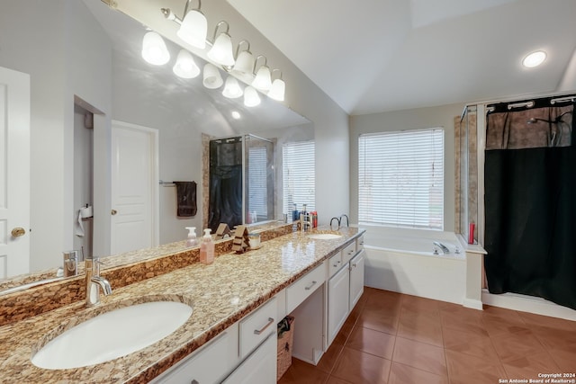 bathroom featuring tile patterned floors, vanity, independent shower and bath, and vaulted ceiling