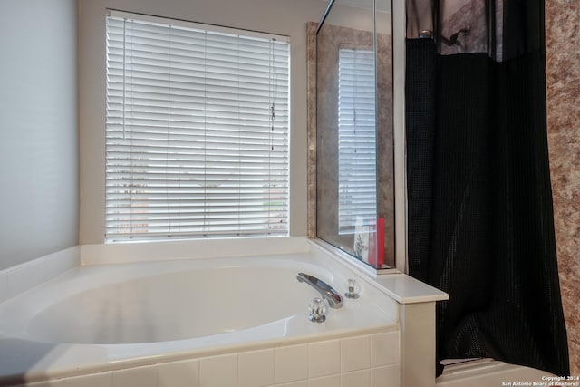 bathroom with tiled bath