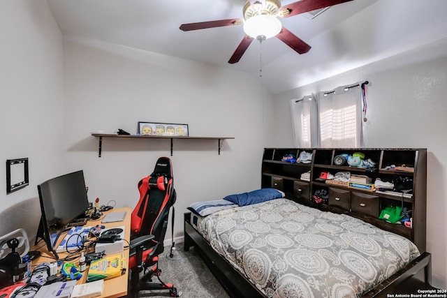 bedroom with carpet flooring, ceiling fan, and vaulted ceiling