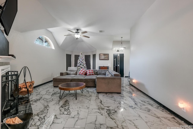 living room featuring ceiling fan with notable chandelier and vaulted ceiling