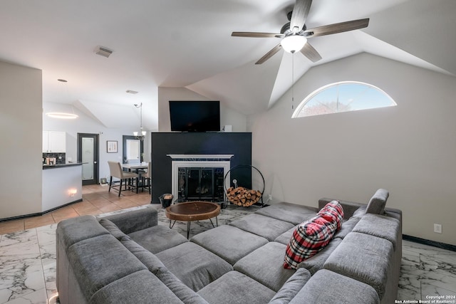 living room with ceiling fan and lofted ceiling