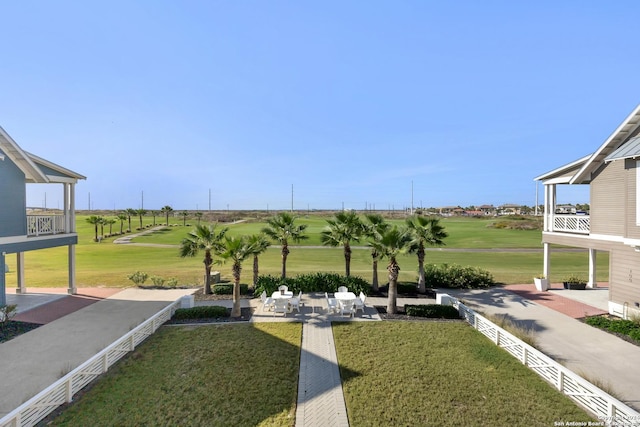 surrounding community featuring a yard and a patio