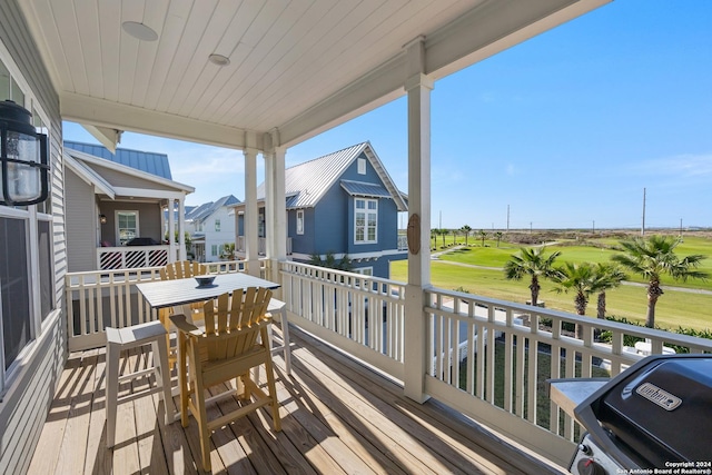 wooden terrace featuring grilling area