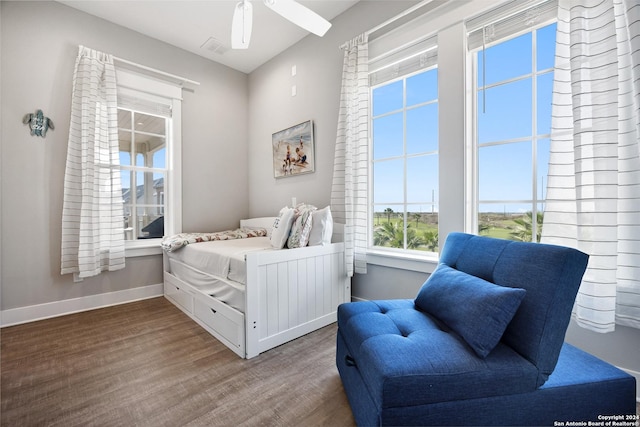 bedroom with wood-type flooring and ceiling fan