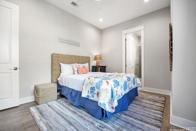 bedroom featuring dark hardwood / wood-style floors and ceiling fan