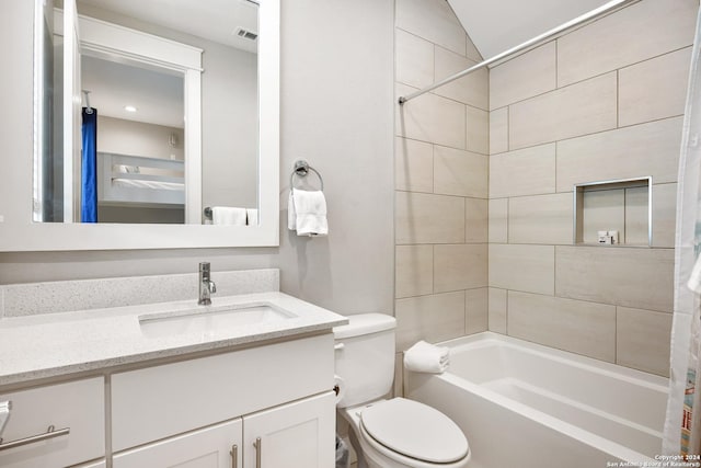 full bathroom with vanity, shower / tub combo, and toilet