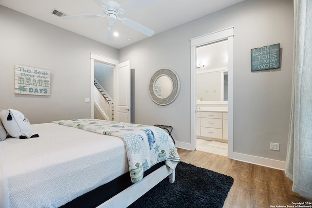 bedroom featuring connected bathroom, ceiling fan, and hardwood / wood-style flooring