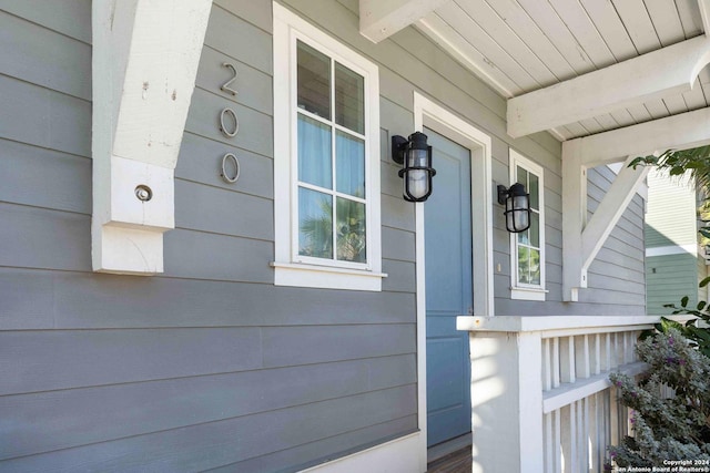 view of property exterior featuring covered porch