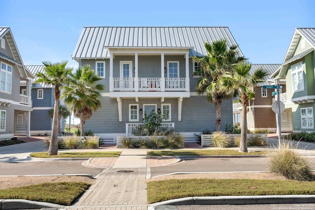 view of front of home featuring a balcony