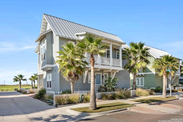 view of front of property with a balcony