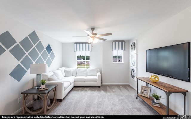 living room with ceiling fan and light colored carpet