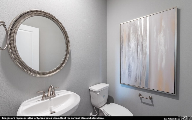 bathroom with toilet and sink