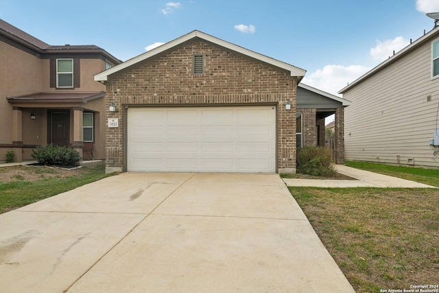 view of front of house featuring brick siding, concrete driveway, and an attached garage
