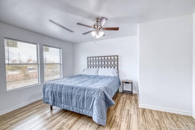 bedroom featuring ceiling fan and light wood-type flooring