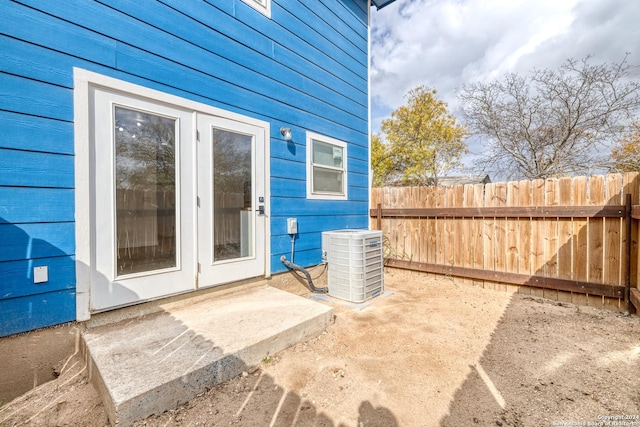 property entrance featuring a patio area and central AC