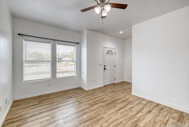 unfurnished room featuring ceiling fan and light hardwood / wood-style flooring