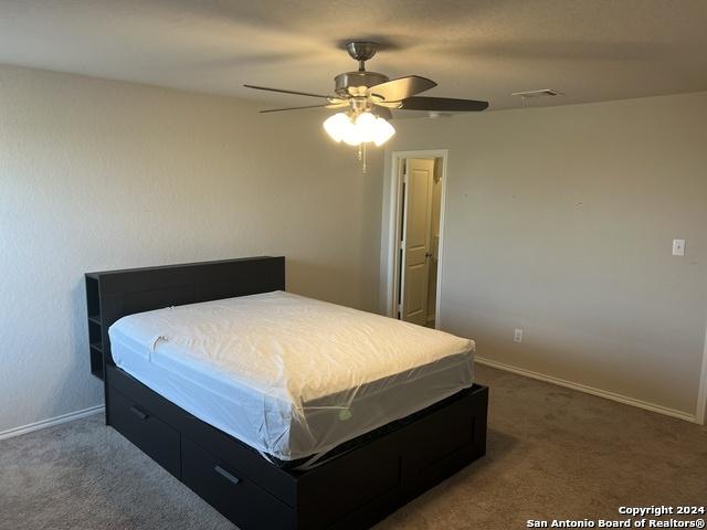 bedroom with carpet flooring and ceiling fan