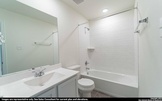 full bathroom with tile patterned floors, vanity, tiled shower / bath combo, and toilet