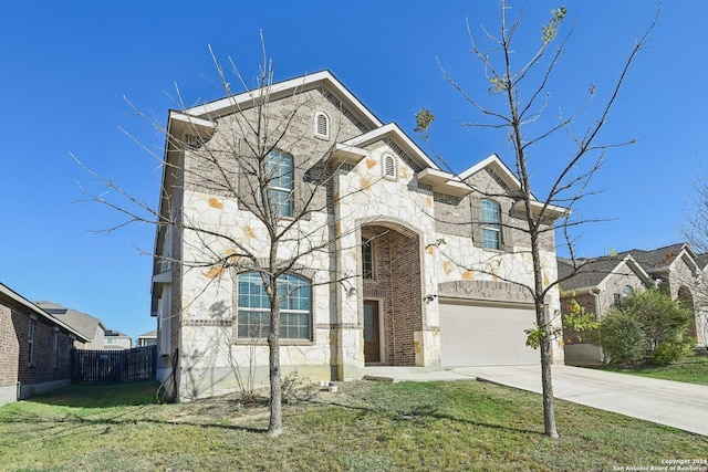 view of front facade featuring a front yard and a garage