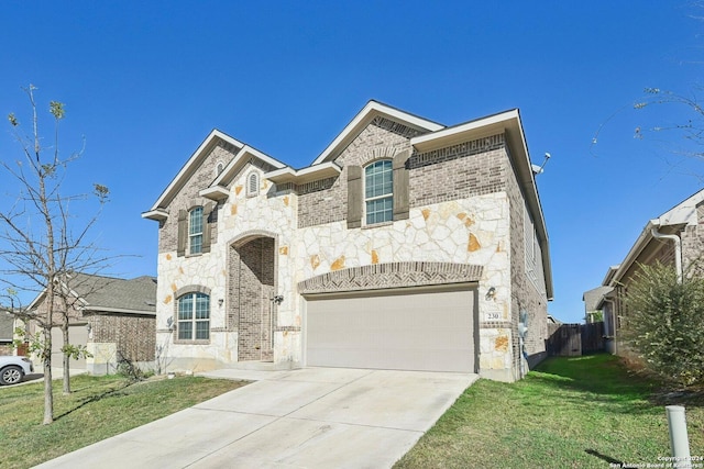 view of front of house with a front yard and a garage