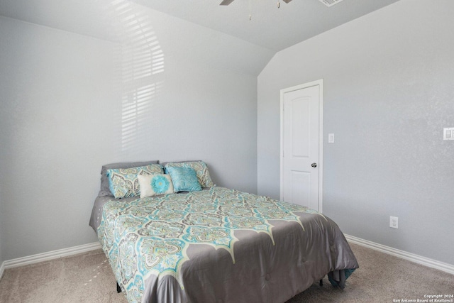 bedroom with ceiling fan, carpet, and lofted ceiling