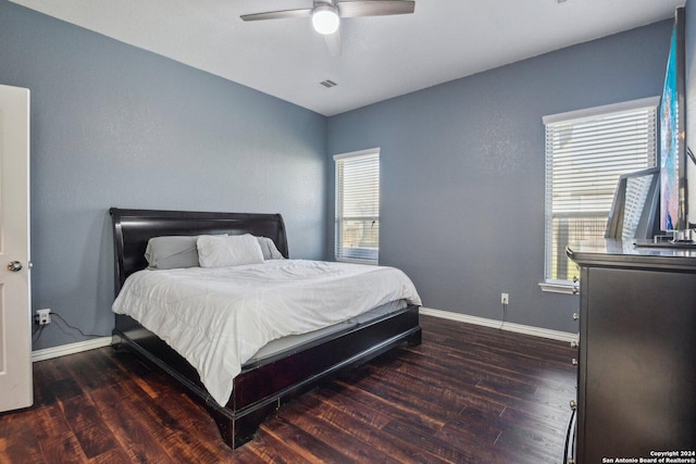 bedroom featuring ceiling fan and dark wood-type flooring