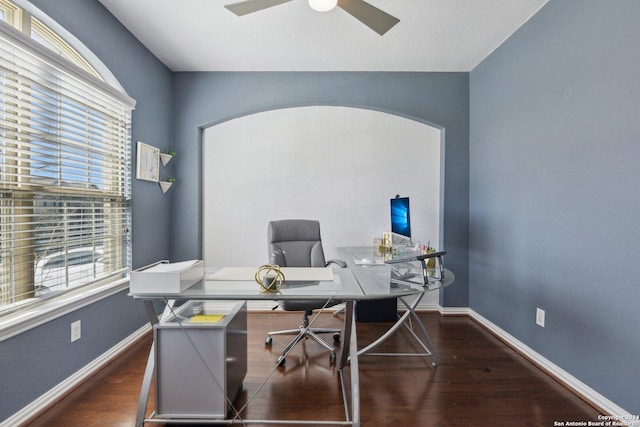 office with dark hardwood / wood-style floors and ceiling fan