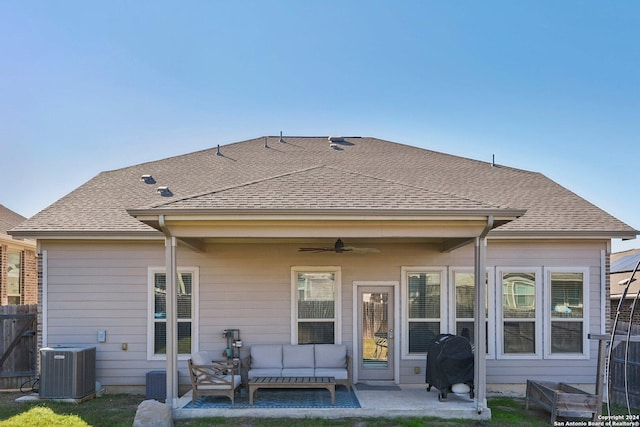 back of property with a patio area, ceiling fan, cooling unit, and an outdoor living space