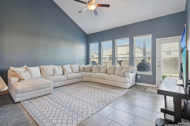 living room featuring tile patterned flooring, high vaulted ceiling, and ceiling fan