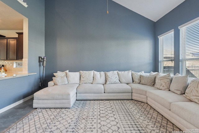 living room featuring vaulted ceiling