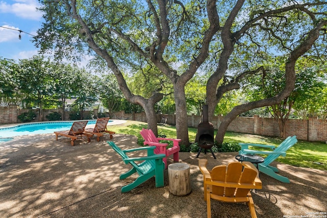 view of patio featuring a fenced in pool