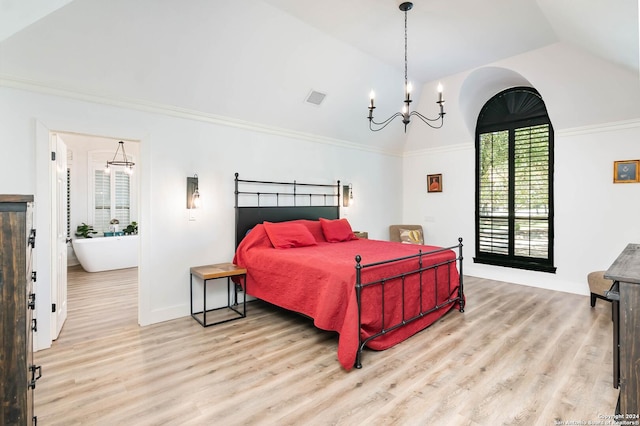 bedroom with light hardwood / wood-style floors, vaulted ceiling, and a notable chandelier