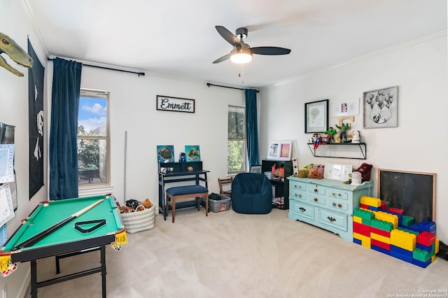 rec room featuring ceiling fan, ornamental molding, light carpet, and billiards