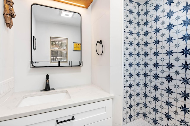 bathroom featuring vanity and walk in shower