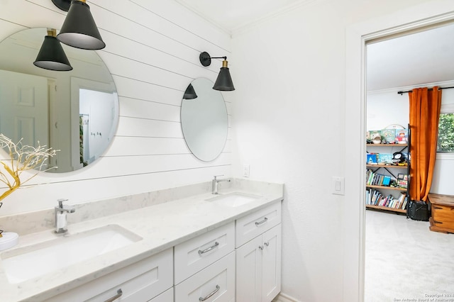 bathroom with vanity, wooden walls, and ornamental molding