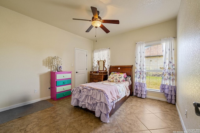 bedroom featuring ceiling fan and light tile patterned floors