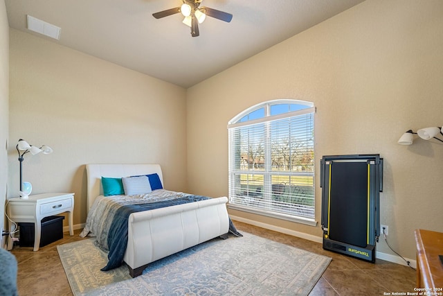 tiled bedroom with ceiling fan