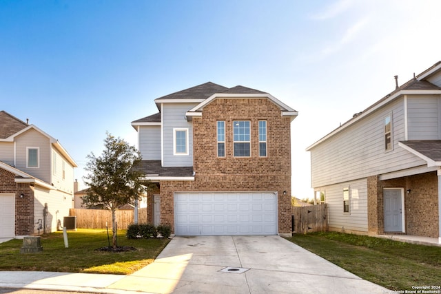 view of property featuring a front yard, a garage, and cooling unit