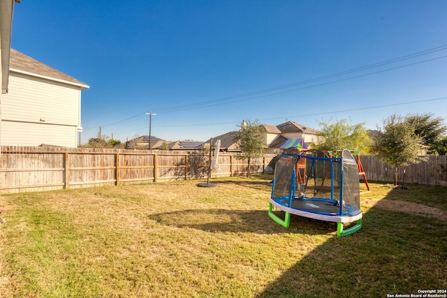 view of yard featuring a trampoline