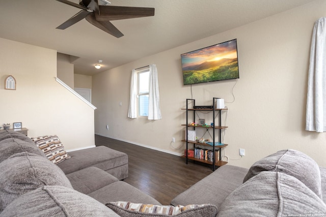 living room featuring dark hardwood / wood-style floors and ceiling fan