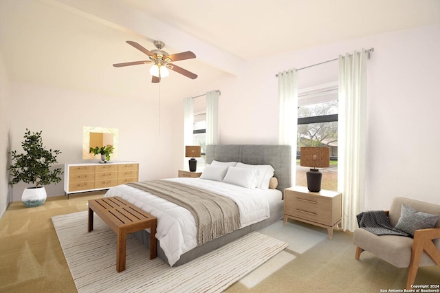 carpeted bedroom with ceiling fan and beamed ceiling