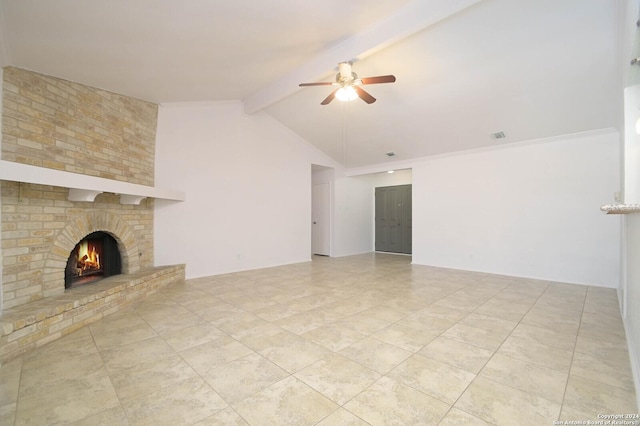 unfurnished living room with ceiling fan, lofted ceiling with beams, and a fireplace